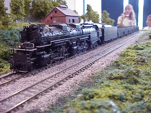 Moments later, the big C&O Allegheny rumbles over the same track with a string of loaded hoppers.